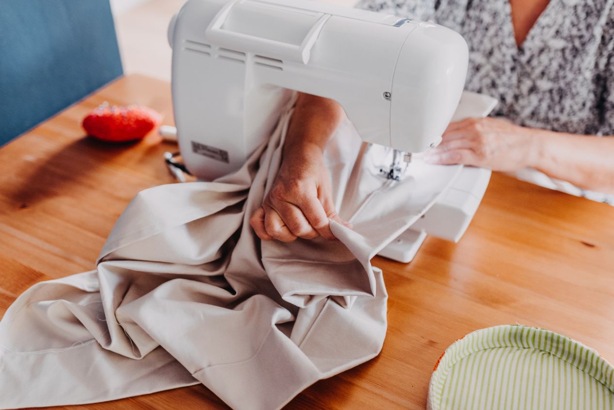 A woman's hands using a sewing machine