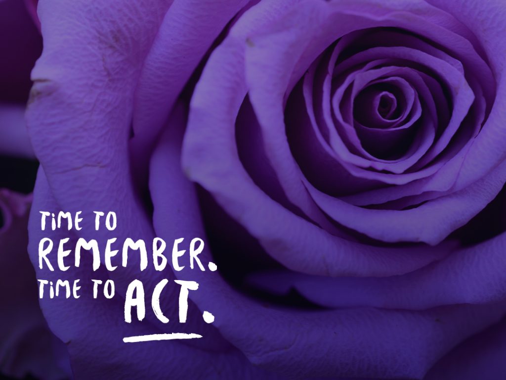 An image of a blooming rose. The image is tinted in purple, the colour of International Overdose Awareness Day. The words 'Time to remember. Time to Act.'